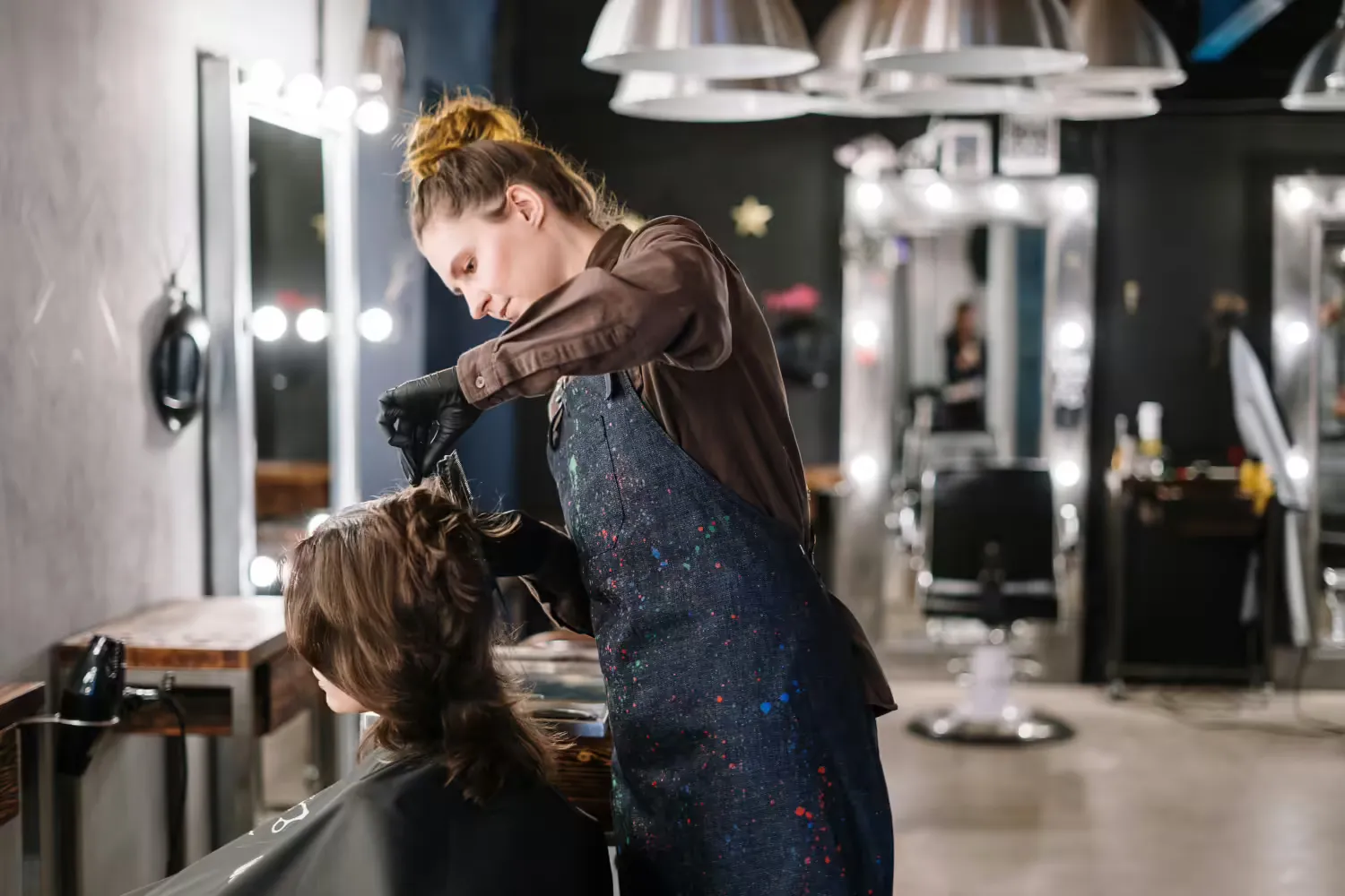Professional hairstylist creating beautiful hair